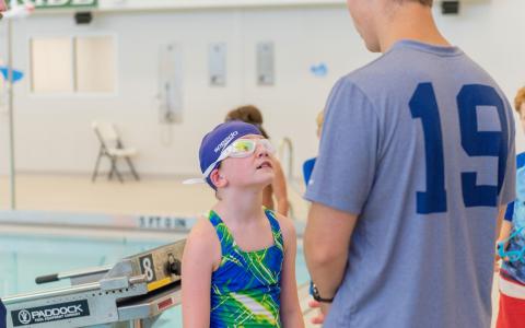 Caden Griffis gives instructions to a swimmer during camp at Tallulah Falls School last week. E. LANE GRESHAM/Special