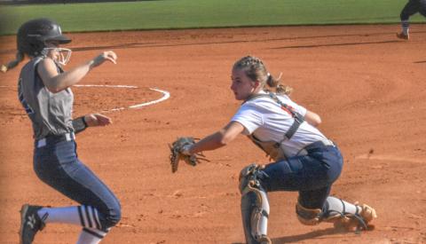 Taylor Wade tags out a White County player trying to score after receiving a great throw from center fielder Hailey Wade. CODY ROGERS/Staff 