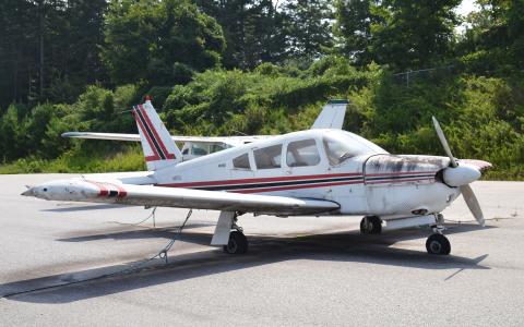 Shown is one of two abandoned airplanes have been sitting at the Habersham County Airport for nearly a decade. BRIAN WELLMEIER/Staff
