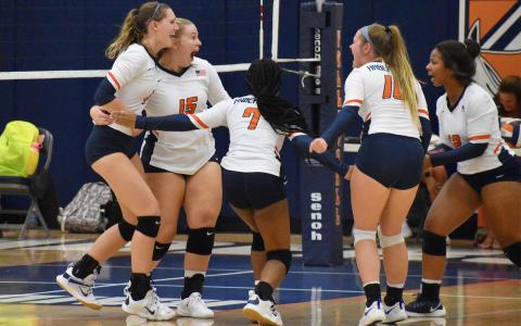 The Lady Raiders celebrate after winning the first match Tuesday night. CODY ROGERS/Staff