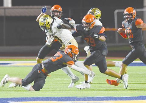 Habersham Central’s Carter Barrett (23) and B.J. Hodges (79) bring down a runner during the win over Apalachee. TOM ASKEW/Special
