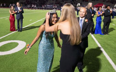 Preslee Hix crowns Angela Lee homecoming queen on Friday night as her dad Rick Lee looks on. TOM ASKEW/Special