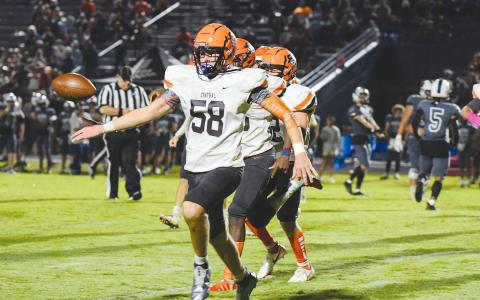 Habersham Central’s Jonathan Adams tosses the ball to an official after forcing a fumble on the first play of the second half against White County. TOM ASKEW/Special