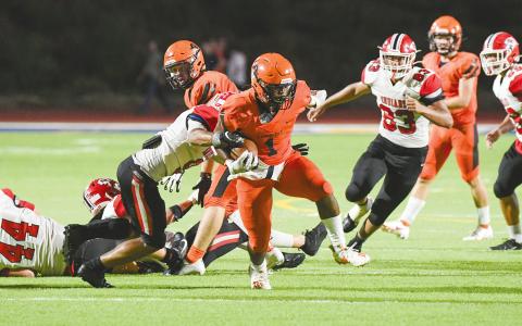 Habersham Central’s Sirmarcus Burney battles through a tackle against Stephens County. TOM ASKEW/Special