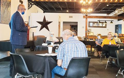Ken Watkins, coordinator with Franklin County Family Connections, engages volunteers at CASA’s Toccoa location. BRIAN WELLMEIER/Staff