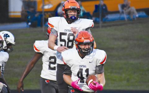 Habersham Central’s Garrett Turner (41) and Jonathan Adams celebrate Turner’s blocked punt touchdown Friday night against White County. MATTHEW OSBORNE/Staff