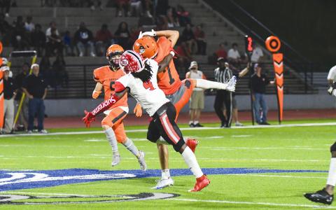 Habersham Central’s Caleb Wade goes up high for a catch against a Stephens County defender last week. TOM ASKEW/Special 