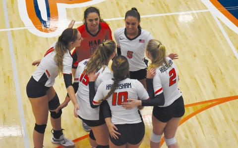 Habersham  Central’s  volleyball team gathers for a quick conference during a recent home game. CODY ROGERS/Staff