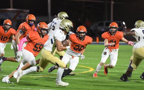 Habersham Central’s Zane Hester (59) Brennon Clouse (20) and Braydon Wright (31) pursue a Dacula ballcarrier on Friday night. TOM ASKEW/Special