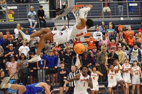Habersham Central’s Malachi Dooley jams it home in the final seconds of Friday’s win over Banks County, to the delight of his teammates and home fans. CODY ROGERS/Staff