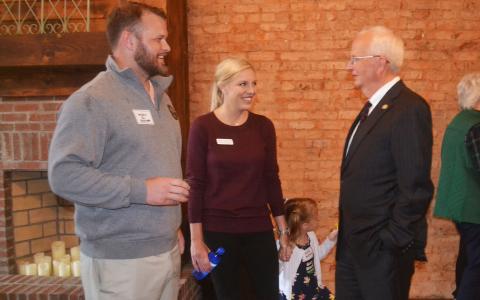 Gary Black (right) chats with Georgia Sen. Bo Hatchett, his wife Ashley and daughter Hallie. BRIAN WELLMEIER/Staff