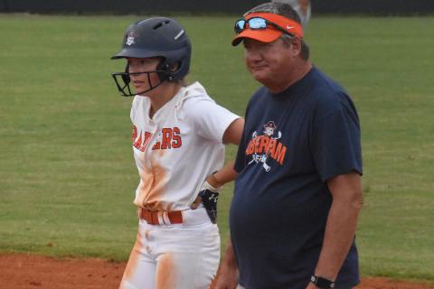 Coach Bill Bradley meets with Bailey Barfield after she reached base during a Lady Raiders 2021 home game. CODY ROGERS/Staff
