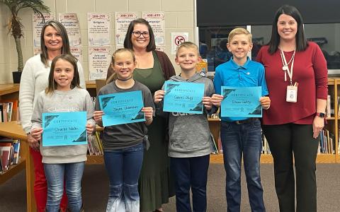 Shown in back row (from left) Leslie Foster, Cameron Lopez and Ansley Green help recognize EarlyAct students (from left) Charlee Nash, Jaysee Chambers, Gabriel Olliff and Ethan Gailey. BRIAN WELLMEIER/Staff