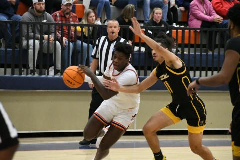 Bryce Pittman drives to the hoop on Friday night.