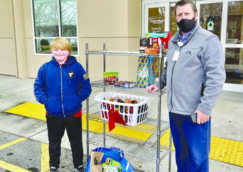 Max Daniel (left) delivers goods he gathered for donation to healthcare workers at Habersham Medical Center, where they were accepted by Matthew Miles. TRICIA HISE/Submitted