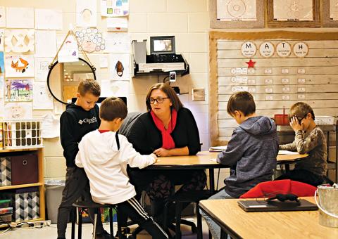 Elissa Hipps works with second graders at Fairview Elementary on Thursday afternoon. Students returned to classes on Wednesday. BRIAN WELLMEIER/Staff