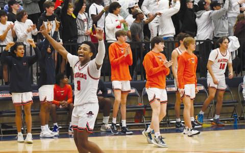 Malachi Dooley celebrates the Raiders’ big region win over Dacula. CODY ROGERS/Staff