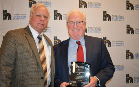 Wade Rhodes presented Phil Sutton (right) with his award for 2021 Habersham Countian of the Year at the gala event Feb. 10. BRIAN WELLMEIER/Staff