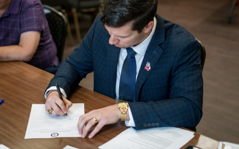 Former Georgia football player Ben Souther signs his paperwork to run for U.S. Congress. Souther is one of four Republicans vying for the seat currently held by U.S. Rep. Andrew Clyde. BRYCE BARRETT/Submitted