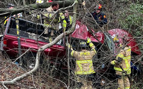 First responders try to assess the condition of the driver after an accident on J. Warren Road on Wednesday afternoon. SGT. DANIEL SEELEy/Submitted