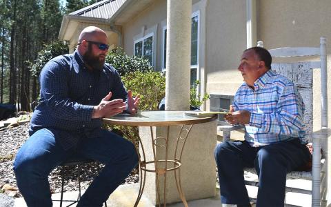 Nathan Dodd (left) receives counseling from licensed counselor Mark Beach. BRIAN WELLMEIER/Staff