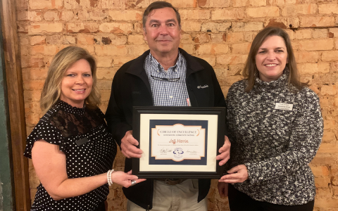 Circle of Hope’s Linda Shadburn (left) and Suzanne Dow (right) present the Circle of Excellence award to Jeff Herrin. LINDA SHADBURN/Submitted 