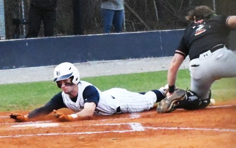 Azzi Cervantes slides in safely to score a run in the first inning against Lanier. CODY ROGERS/Staff