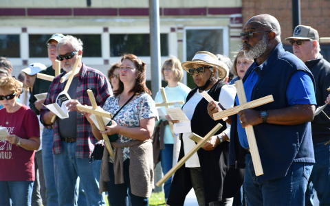 One of the many members of the Good Friday Cross Walk was Mt. Zion Baptist Church Pastor Benjamin Hawks, who is pictured above, on the right, singing with dozens of other walkers who gathered around the Clarkesville gazebo and sang hymns. CODY ROGERS/Staff