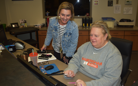 Michelle Wilbanks (left) and Administrative Assistant Kelly Duncan work on a project together at Fairview Elementary. AMARIS E. RODRIGUEZ/Staff