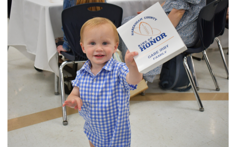 Judah Irby, the 22-month-old son of Habersham Central Ring of Honor inductee Gabe Irby, showed  everyone at Thursday’s banquet that he already knows his football. He teed up his dad’s table marker after seeing that it contained a football, and he kicked it like it was 7 p.m. on Friday night. MATTHEW OSBORNE/Staff