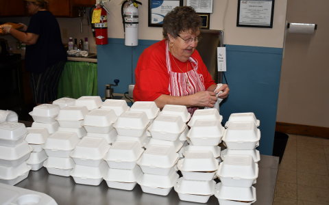 Clarkesville Soup Kitchen Director Betty Jones oversees the packing of desserts to go with meals on Saturday morning. MATTHEW OSBORNE/Staff