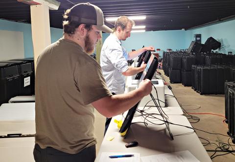 Habersham County Election Tech/Coordinator Izac Martin and Poll Manager Derek LaPerriere conduct the logic and accuracy testing on Habersham County’s voting machines in preparation for the primary Tuesday, May 24.