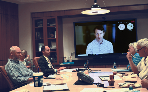 Hospital Authority board member Josh Garrett, CEO Tyler Williams, Ken Johnson (on screen), Chair Dolly Ritchie and Terry Loudermilk discuss business at HMC Tuesday.  BRIAN WELLMEIER/Staff