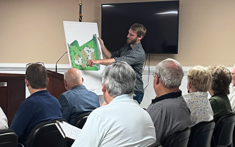 Joe Sleppy shows off the drawings for a proposed 48-unit apartment complex on Arlington Street in Demorest. MATTHEW OSBORNE/Staff