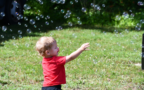 Luke Sargent loved the bubble machine at the Kids on Wheels event in Clarkesville on Saturday. There was fun of all kinds for youngsters to enjoy on a summer day. MATTHEW OSBORNE/Staff