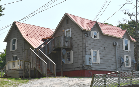A wheelchair-bound woman and her autistic son were forced to vacate this home on King Street in Baldwin. BRIAN WELLMEIER/Staff