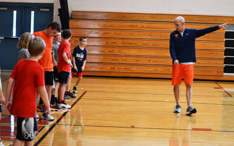 Habersham Central boys basketball coach Tommy Yancey (right) leads campers in a drill at South Habersham Middle School on Monday morning. MATTHEW OSBORNE/Staff