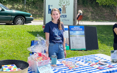 Family Support Specialist Campbell Weidemeier works a  station at a resource fair at Hope Center in Toccoa. MELANIE ALLEN/Submitted