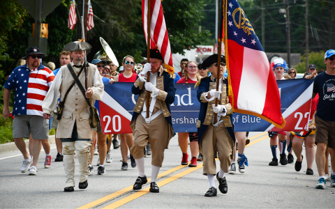 Habersham Central Band of Blue marched behind flag bearers (from left) Sid Turner, Larry Whitfield and David Burton from the Sons of the American Revolution. MATTHEW OSBORNE/Staff