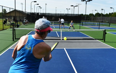 Kim Perry serves to Denise Ralph during pickleball action Monday morning in Clarkesville. MATTHEW OSBORNE/Staff