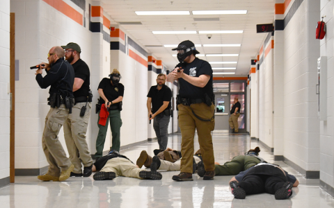 Deputies clear the hallway at Habersham Central during active shooter drill Thursday. BRIAN WELLMEIER/Staff