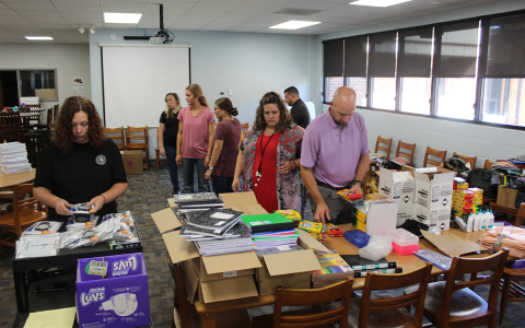 Volunteers got together at 9 a.m. at the Ninth Grade Academy to organize donated school supplies. AMARIS E. RODRIGUEZ/Staff