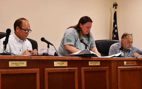 Councilwoman Alice Venter (middle) reviews renderings a townhouse development while Mayor Joe Elam (left) and  Councilman Larry Lewallen (right) consider logistics of the project. BRIAN WELLMEIER/Staff
