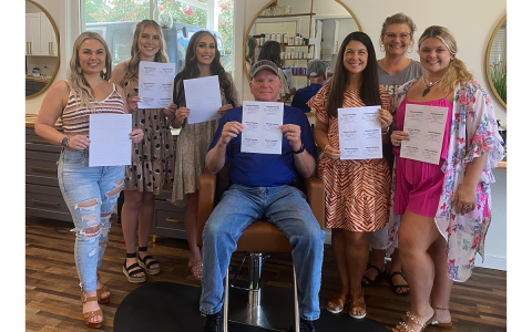Dusti Casey met with members of Habersham County Family Connections on Wednesday at Renown Artistry Beauty Studio in Clarkesville to present them with the donated haircut vouchers. From left are Dusti Casey, owner of Renown Artistry; Caitlin Jarrell, stylist; Grayce Grizzle, assistant; Rob Moffett, Habersham Schools Counselor Coordinator; Lauren Fair, counselor at Clarkesville Elementary School; Donna Barrett, Habersham County Family Connection Executive Director; Madison Parks, stylist.