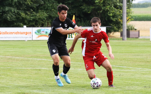 Jake Hall (right) looks to beat a defender in the midfield during play in Germany. ROBBIE HALL/Submitted