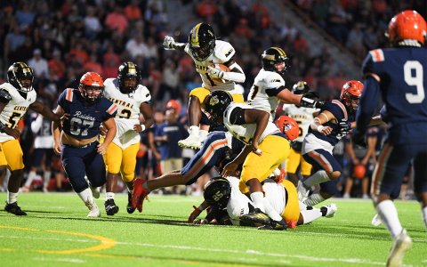 Central Gwinnett’s Jason Jackson leaps over blockers and defenders on his way to a first-half touchdown against Habersham Central on Friday night. TOM ASKEW/Special