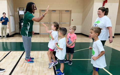 Piedmont basketball player Orry Clements Owen high-fives children from Clarkesville First United Methodist Church  Preschool including Annabelle Carter, Bo McGahee, Sam Osborne and Jeremiah Garcia. RACHEL PLEASANT/Submitted 