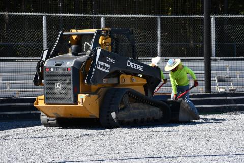 Workers from Hellas Sports Construction get the field ready for the laying of artificial turf at Raider Park in Demorest. MATTHEW OSBORNE/Staff
