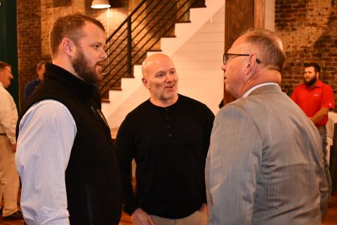 Sen. Bo Hatchett (left) talks with Jeff Wilson and Jim Weidner at his victory party in Cornelia on Tuesday night. MATTHEW OSBORNE/Staff