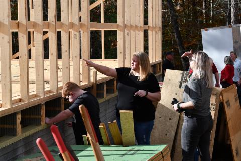 Jennifer Payne and her son Caleb show friends how things are looking for their future home in Demorest. MATTHEW OSBORNE/Staff